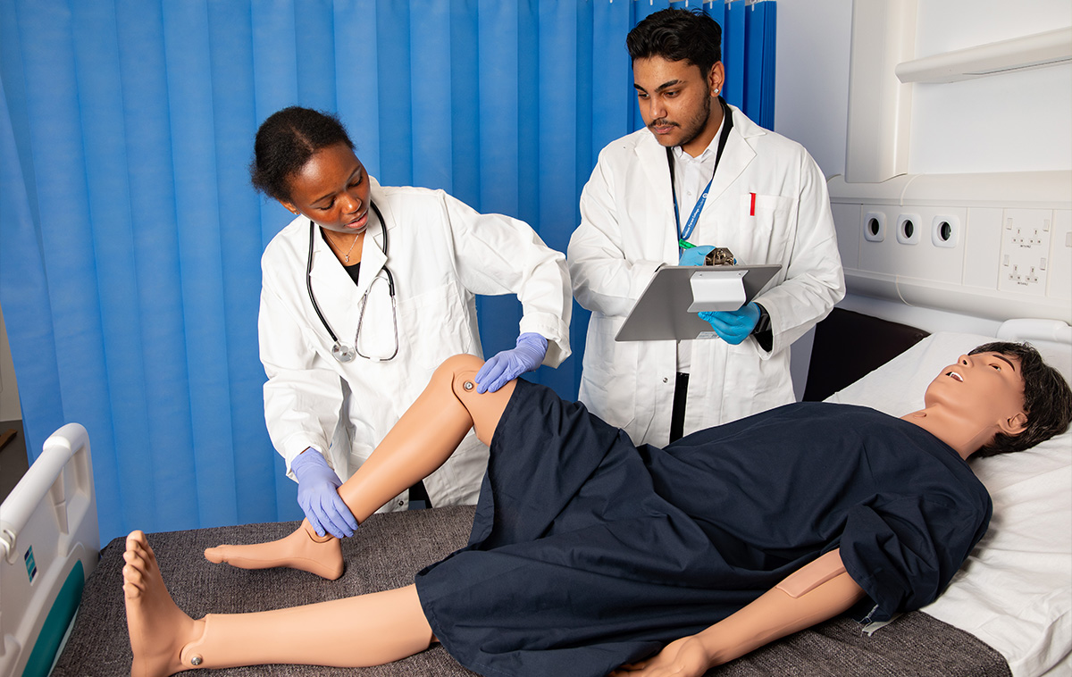 T Level students working with a dummy patient