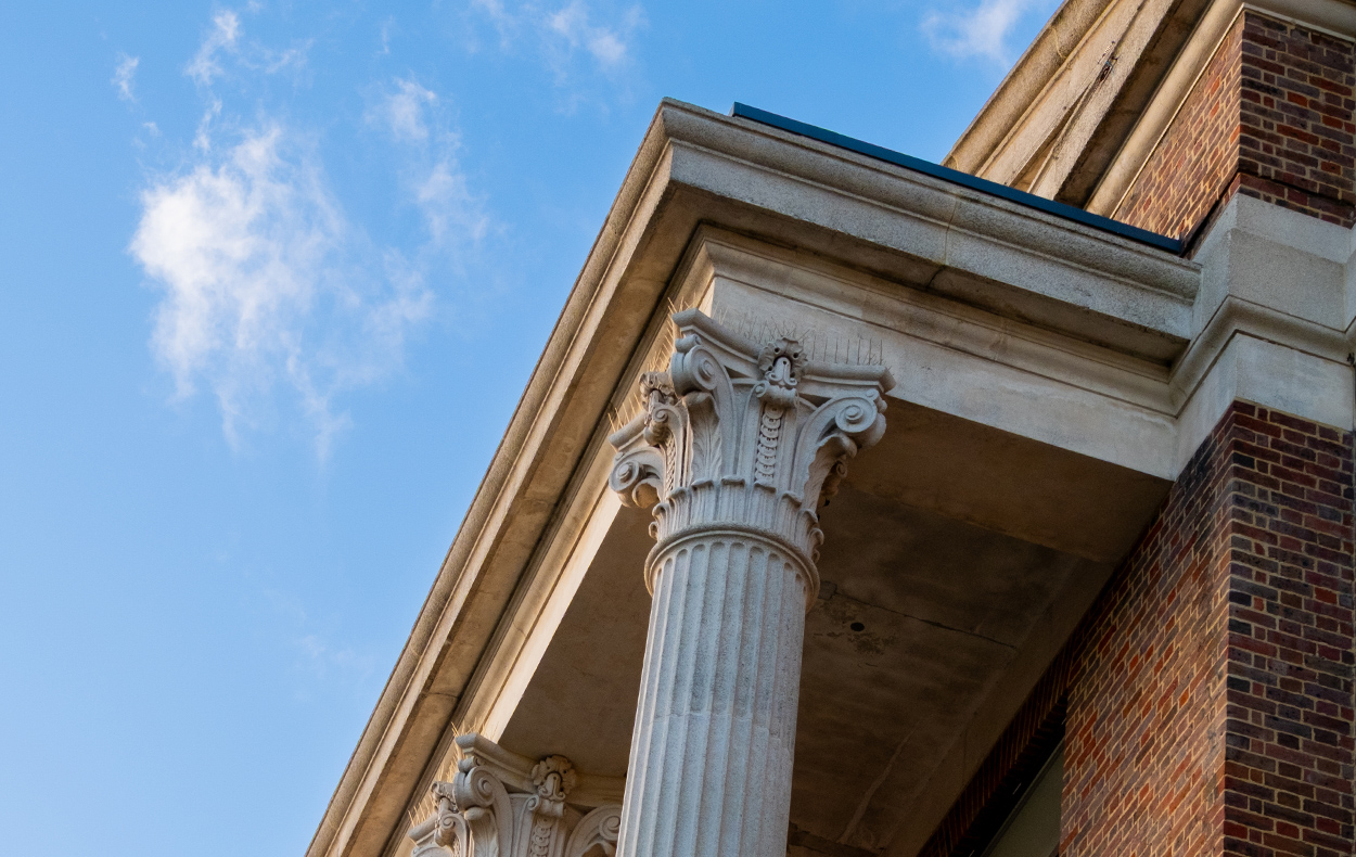 Waltham Forest College corner of building with column against blue sky