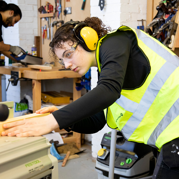 Student at a woodworking table